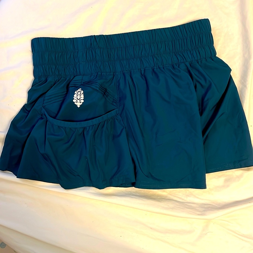 NWOT Free people get your flirt on shorts. Hard to find size XS Bluegrass color.